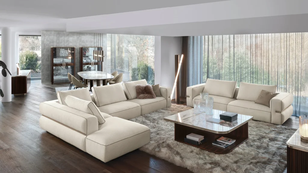Light sofas and dark coffee tables in a coordinated living and dining room.